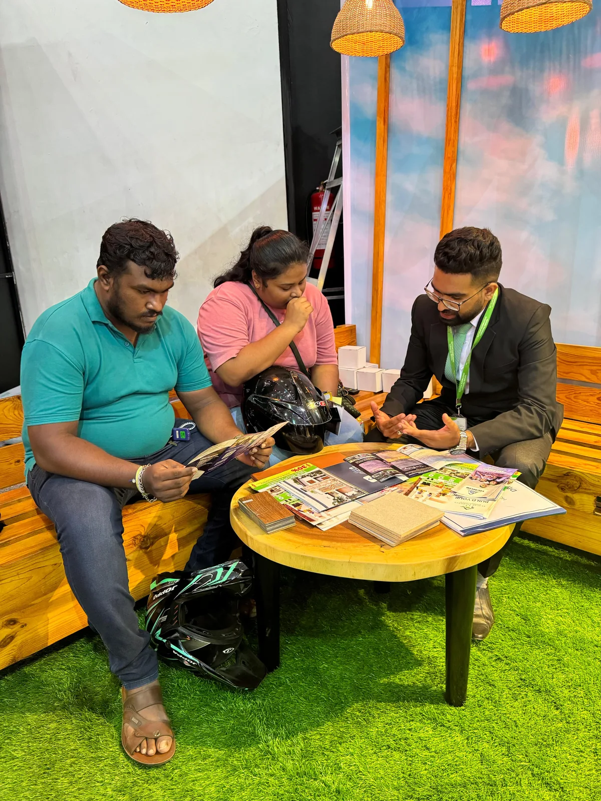 Structa team member discussing plans and finish samples with clients